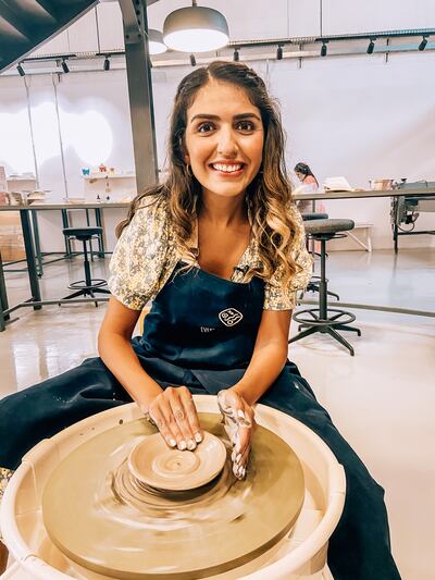 Nada Badran tries her hand at the potters' wheel in The Mud House Studio, Al Quoz, Dubai. Photo: Nada Badran