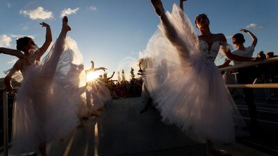 Participants attend an outdoor ballet lesson during the Global Ballet Holidays Festival in Moscow, Russia. Reuters