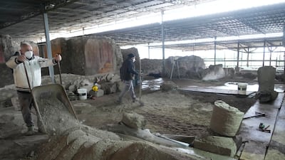 Excavations are carried out inside the 'House of the Library' at Pompeii.