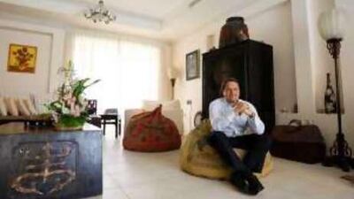 Adrian Rudin at home among furniture he has collected throughout Asia, a practice that began while working for The Peninsula Hotel in Hong Kong.