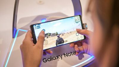 A woman plays the PlayerUnknown's Battlegrounds (PUBG) game on a Samsung Electronics Co Galaxy Note 9. Bloomberg