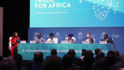 From left, Mina Al-Oraibi, Editor-in-Chief of The National; Jean Ngabitsinze, Rwanda's Minister of Trade and Industry; Shadiya Assouman, Benin's Minister of Industry and Trade; Ngozi Okonjo-Iweala, WTO Director General; and the World Bank's Pablo Saavedra and Ousmane Diagana during a WTO panel discussion in Abu Dhabi. Pawan Singh / The National