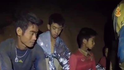 A video grab handout made available by Thai Royal Navy shows some of the members of the trapped football team. Royal Thai Navy / EPA