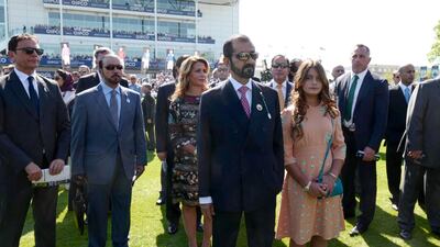 Sheikh Mohammed bin Rashid, Vice President and Ruler of Dubai, watches the 2000 Guineas Stakes, the first Classic horse race of the British racing season, at Newmarket. Also pictured: Princess Haya of Jordan, wife of Sheikh Mohammed bin Rashid, and their daughter Sheikha Al Jalila bint Mohammed. Wam