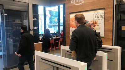 A customer walks out of an Amazon Go store in Seattle in the US without needing to pay at a cash register due to cameras, sensors and other technology that track goods that shoppers remove from shelves and bill them automatically after they leave. Photo: Reuters