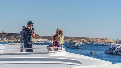 Posing for photographs on yachts is a popular pastime at the resort