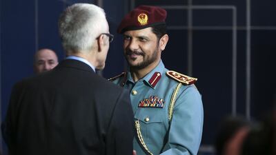 Brig Hamad Al Amimi greets Jurgen Stock, Interpol’s secretary general, on Monday ahead of the Unity for Security Forum at the Abu Dhabi National Exhibition Center. Delores Johnson / The National