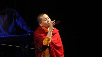 Buddhist nun and pop star Ani Choying Drolma performing at a concert in Mumbai, India on October 7, 2016. With more than 12 albums of melodious Nepali tunes and Tibetan hymns that highlight themes of peace and harmony, the Nepali songstress in saffron robes has won hearts across the Himalayan nation and abroad. Rajanish Kakade/AP Photo