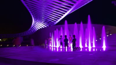 The amphitheatre at Mushrif Central Park is illuminated by pink lights in support of breast cancer awareness month. Vidhyaa for The National