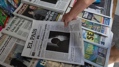 Front pages of newspapers are displayed with the news of Spain's former monarch, King Juan Carlos I, in Madrid. AP