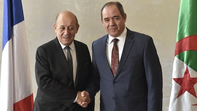 Algerian Foreign Minister Sabri Boukadoum (R) receives his French counterpart Jean-Yves Le Drian in the capital Algiers, on January 21, 2020. Le Drian arrived to Algiers for a brief visit to discuss bilateral and regional issues, starting with the Libyan crisis and the Sahel. / AFP / RYAD KRAMDI