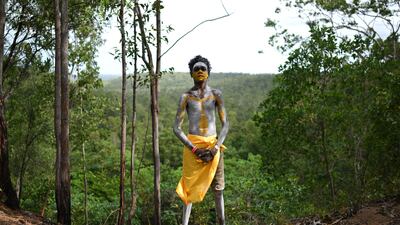 A member of the Gumatj clan of the Yolngu people from north-eastern Arnhem Land prepares for the bunggul traditional dance at the Garma Festival in Australia's Northern Territory. EPA