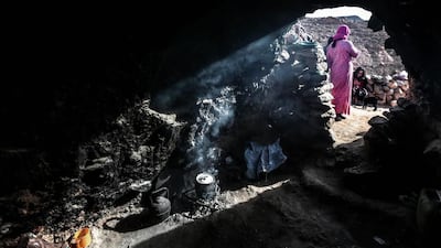 Aesha, 45, and her family live in this cave in the desert of the Anti-Atlas mountains, east of Ourazazate, Morocco.