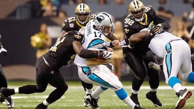 The Carolina Panthers quarterback Jake Delhomme, No 17, is sacked by Roman Harper, No 41, of the New Orleans Saints at Louisiana Superdome on Sunday night. The Saints staged a remarkable comeback to win, marking their best start to a season.
