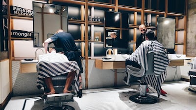 Akin the barber goes cash-free. Courtesy Akin