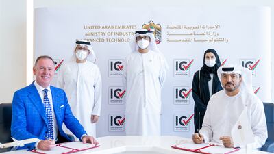 Dr Sultan Al Jaber, Minister of Industry and Advanced Technology, centre, Sarah Al Amiri, Minister of State for Advanced Technology, second right, and Mohammed Al Shorafa, chairman of Etihad Aviation Group, second left, attend the signing of the agreement by Omar Al Suwaidi, undersecretary of the MoIAT and Tony Douglas, group chief executive of Etihad. Photo: MoIAT