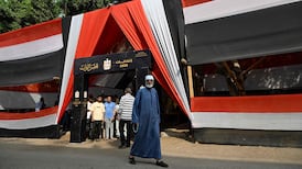 An Egyptian voter leaves a polling station in Giza during the first round of voting. AFP