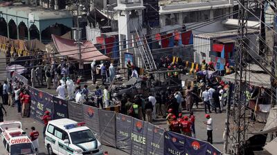 Ambulances are parked outside the cordoned off area. Reuters