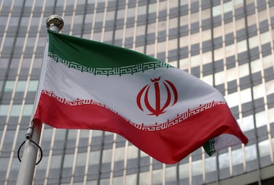 The Iranian flag flies, alongside other national flags, outside the International Atomic Energy Agency headquarters in Vienna. Reuters