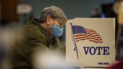 A voter fills out a ballot in the in the US general election on November 3, 2020 in Fayetteville, North Carolina. Over 100 million Americans have already voted in the historic poll. AFP
