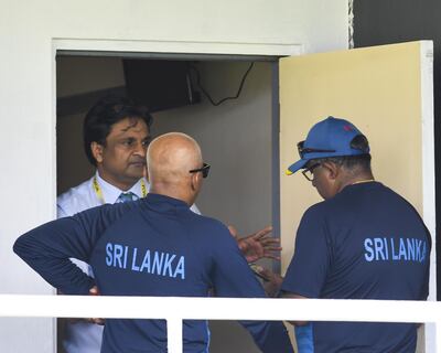 Match Referee Javagal Srinath, left, was involved in an animated chat with Sri Lanka manager Asanka Gurusinha. Randy Brooks / AFP