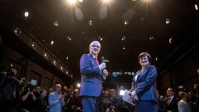Jiri Drahos, left, speaks next to his wife during the election night at his HQ during the first round of the Czech presidential elections in Prague. EPA/MARTIN DIVISEK