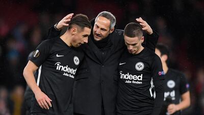 Dominik Kohr, Adi Hutter, coach of Eintracht Frankfurt, and Mijat Gainovic celebrate following their side's victory. Getty