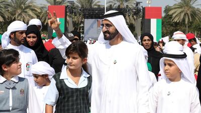 Sheikh Mohammed bin Rashid is accompanied by his daughter Sheikha Al Jalila bin Mohammed during a flag raising event in Dubai.