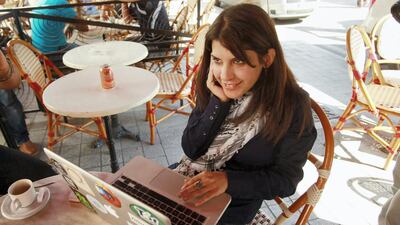 Tunisian blogger Lina Ben Mhenni, who has been tipped for the 2011 Nobel Peace Prize, works on her computer at a cafe in Tunis October 6, 2011. The 2011 Nobel Peace Prize may recognise activists who helped unleash the revolutionary wave that swept through North Africa and the Middle East during the Arab Spring, and Lina Ben Mhenni may be among those in line for the award when announced on Oct. 7, one analyst said. REUTERS/Zoubeir Souissi (TUNISIA - Tags: POLITICS SOCIETY TPX IMAGES OF THE DAY)