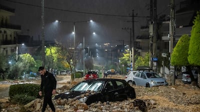 Cars half-submerged in rubble, brought by severe flash flooding, after heavy rain in Ano Glyfada, south of Athens. AFP