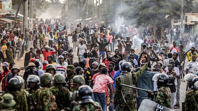 Demonstrators confront Kenyan police officers during clashes at a protest against a US-built Ebola quarantine centre slated to begin operations at Laikipia air base in Nanyuki. AFP