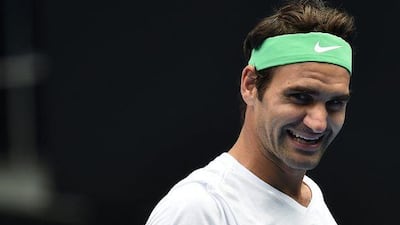 Roger Federer smiles during a practice session ahead of the Australian Open on Friday. Julian Smith / EPA