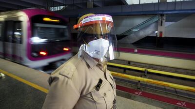 Member of the Bengaluru Metro Rail Corporation Limited (BMRCL) security staff wear mask and face shield to protect herself from the coronavirus Covid-19 pandemic in Bangalore, India, 5 September, 2020. EPA