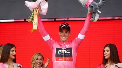BMC's Australian rider Rohan Dennis wears the overall leader's pink jersey as he celebrates on the podium after the second stage of the 101st Giro d'Italia in Tel Aviv.Luk Benies / AFP