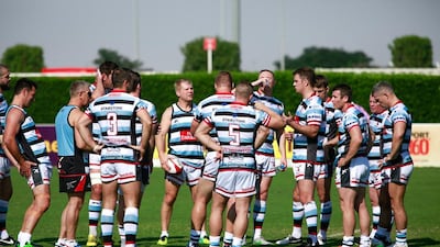 Joining Jack players take on some fluids during a break in the action at the Dubai Rugby Sevens. Victor Besa for The National.