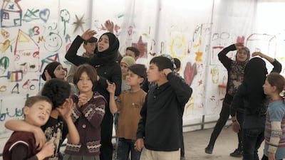 The children and their mentor gather regularly throughout the week in a makeshift tent in Al Bab. Bader Taleb
