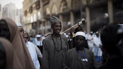 Muslim pilgrims arrive for the afternoon prayer at Mecca's Grand Mosque, home of the cube-shaped Kaaba or "House of God" that Muslims believe was built by Abraham 4,000 years ago, on September 29, 2014 as hundreds of thousands of Muslim worshipers started pouring into the holy city for the annual hajj pilgrimage. This year's hajj comes as the authorities strive to protect pilgrims from two deadly viruses, Ebola and Middle East Respiratory Syndrome coronavirus or MERS. AFP PHOTO/MOHAMMED AL-SHAIKH