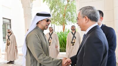 Sheikh Mansour bin Zayed, Deputy Prime Minister and Minister of the Presidential Court, greets Hu Chunhua, Vice Premier of China. Photo: Wam