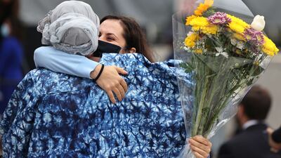 Hafsatou Diallo, originally from Guinea, embraces her friend Yulia Kohut after the conclusion of a naturalisation ceremony in New York City on September 17. The US Citizenship and Immigration Services held its largest naturalisation ceremony welcoming nearly 200 new citizens from 46 countries since the start of the Covid-19 pandemic. Getty Images / AFP