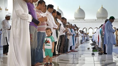 Worshipers gather and pray at the Sheikh Zayed Grand Mosque in Abu Dhabi for the Eid morning prayers. August 19, 2012. Antonie Robertson / The National