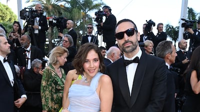 Fatima Al-Banawi, wearing blue Georges Chakra, and Mohammed Al Turki attend the screening of 'Three Thousand Years of Longing' on May 20. Getty Images
