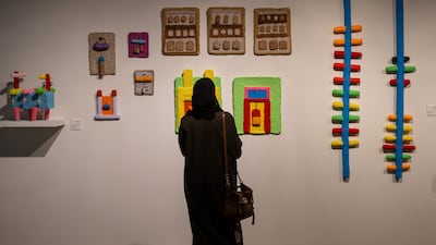 Four colourful interconnected rooms are inscribed with Mohamed Ahmed Ibrahim’s line drawings. Ryan Lim for The National