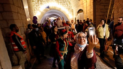 A Palestinian woman takes a selfie. Reuters