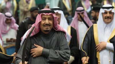 King Salman of Saudi Arabia performs the traditional Ardah sword dance as part of the activities of the Janadriyah cultural festival in Riyadh on February 20, 2018. Bandar Algaloud / Courtesy of Saudi Royal Court / Reuters