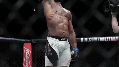 Yoel Romero celebrates after knocking out Chris Weidman during a middleweight mixed martial arts bout at UFC 205, Saturday, November 12, 2016, at Madison Square Garden in New York. Julio Cortez / AP Photo