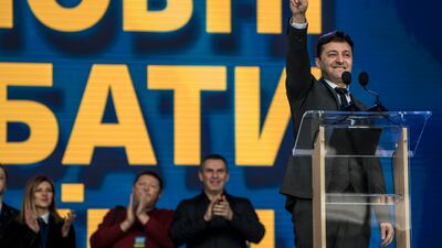 Mr Zelenskyy takes centre stage before a debate with then-president Petro Poroshenko at the Olympiskiy Stadium in April 2019 in Kyiv. Getty Images