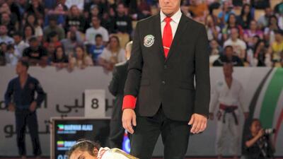 Ishtar Azzawi, in white, competes in the 70kgs blue-belt final at the Abu Dhabi World Professional Jiu-Jitsu Championship 2019.