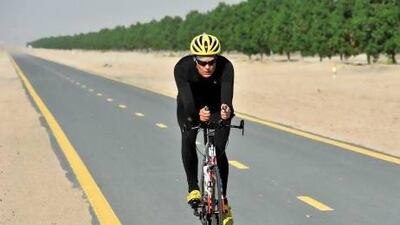 Scott Ragsdale trains at the Al Quadra Bike Track in Dubai for the “Race Across America” to be held this summer. Charles Crowell for The National