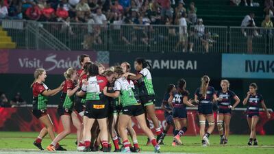 Harlequins players celebrate their triumph against Dubai College.