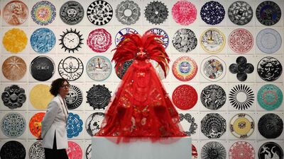 Guests look at work entitled 'Circumference' by Rene Trevino at the Erin Cluley Gallery at the Frieze London 2025 exhibition. AFP